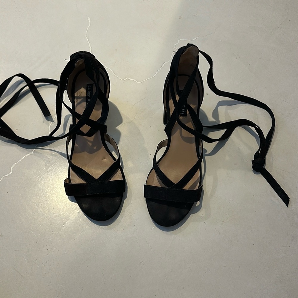 Black sandals ties around ankle